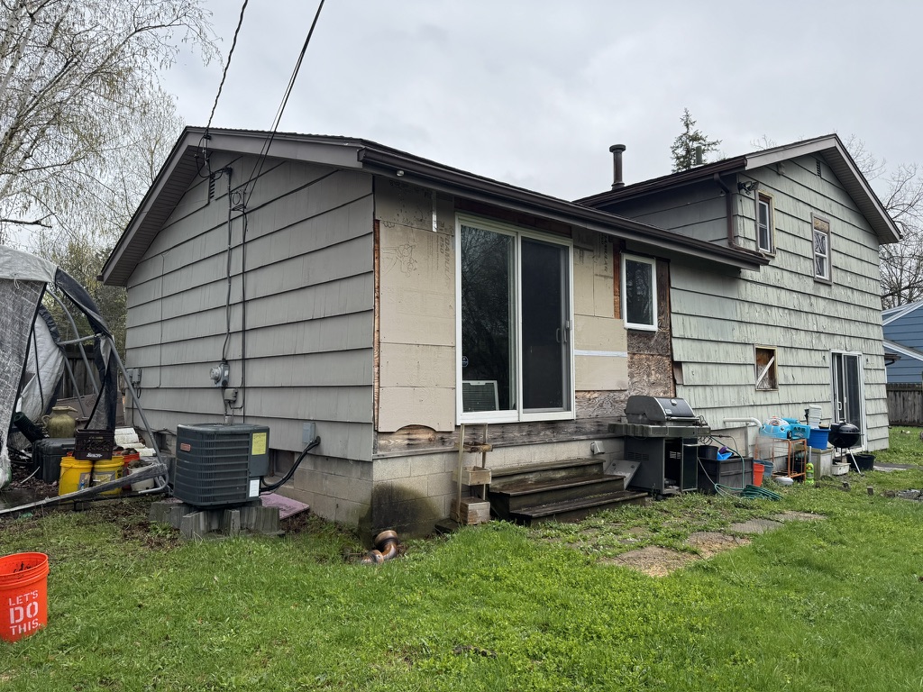 Backyard wide view of rear of house